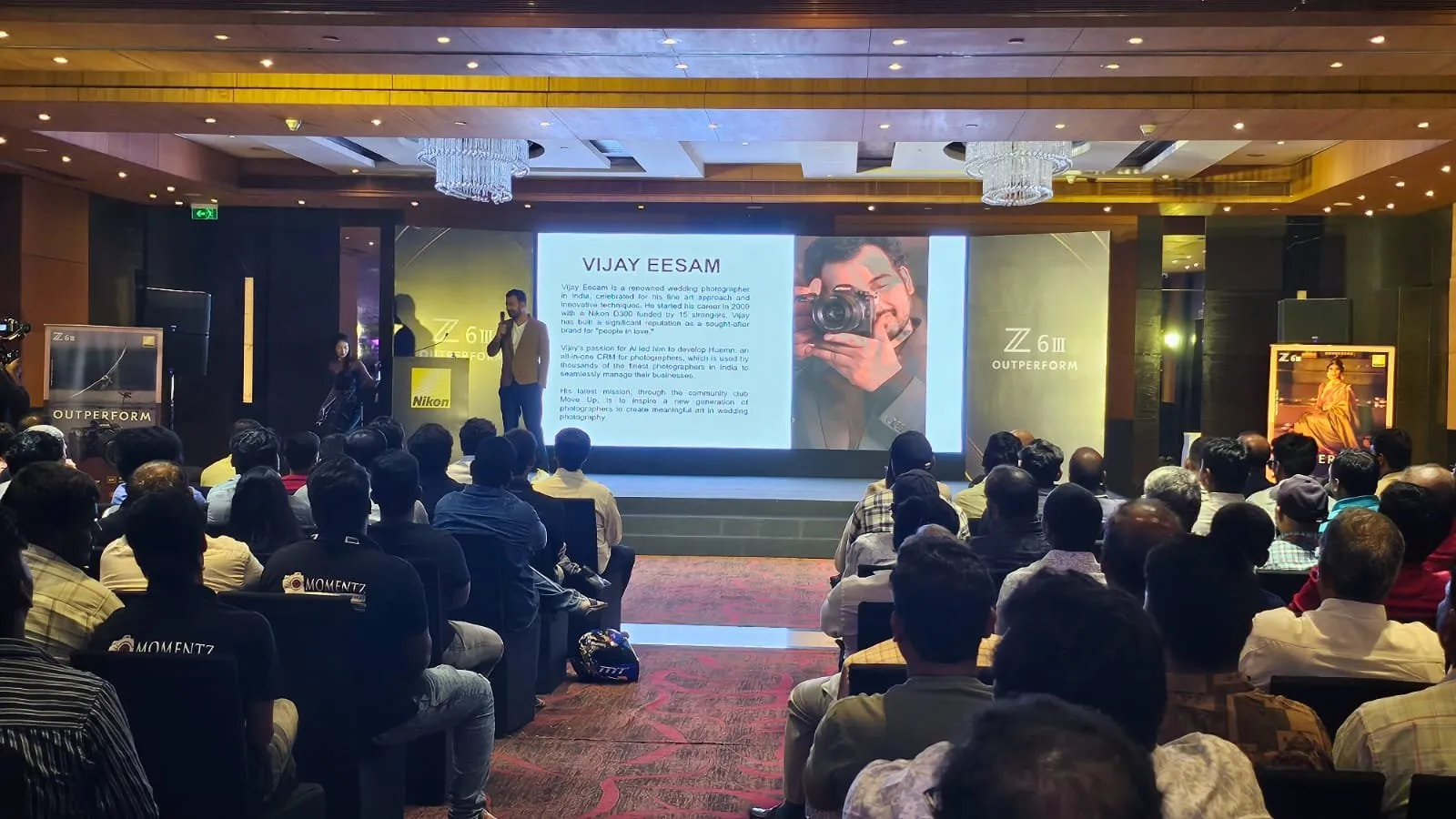 Audience watching a presentation at the Nikon event
